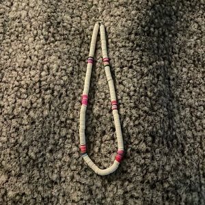 cute necklace with white and pink as main colors